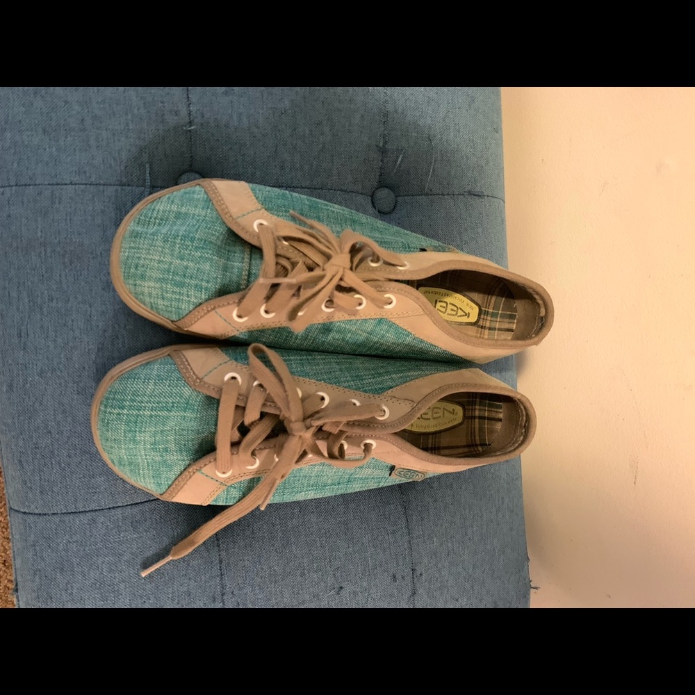 Teal blue and grey sneakers.